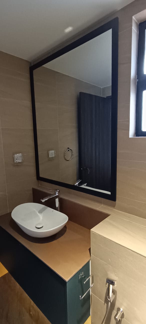 clear mirror with a black wooden frame and integrated LED backlighting