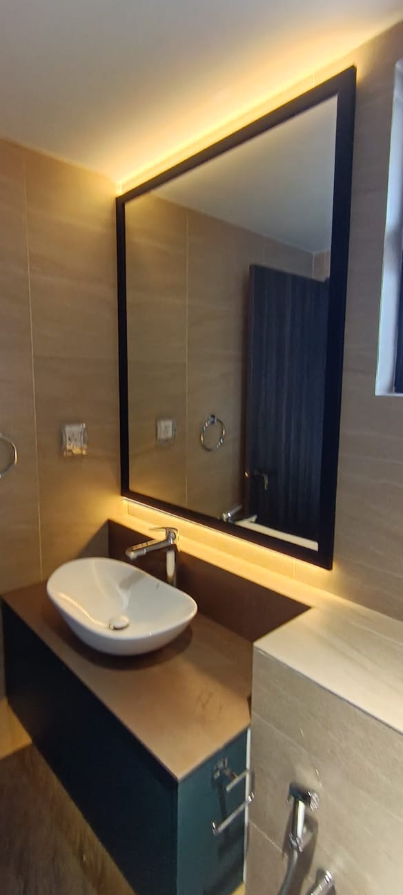 clear mirror with a black wooden frame and integrated LED backlighting