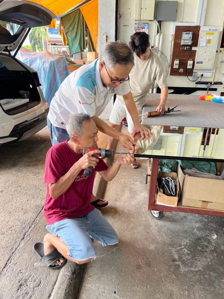staff fixing the mirror
